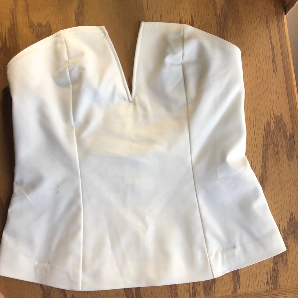 Cream strapless top.
